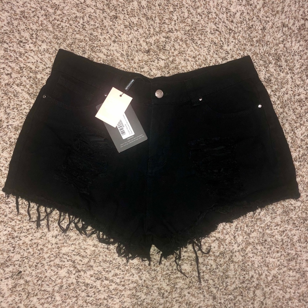 Black distressed shorts